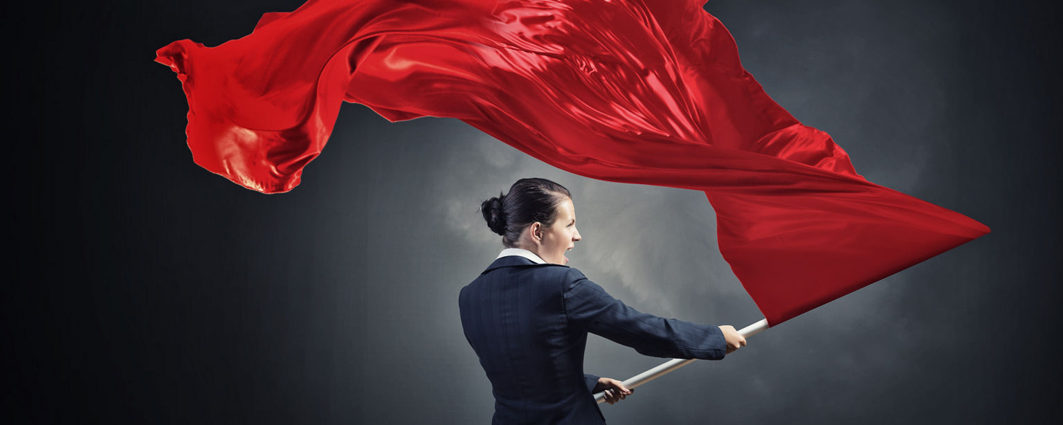 Business Woman Holding Red Flag